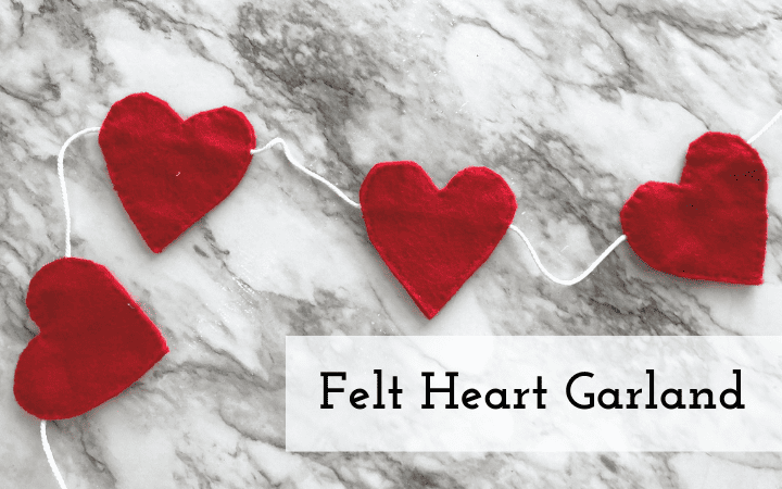 felt hearts along a garland laying out on a table